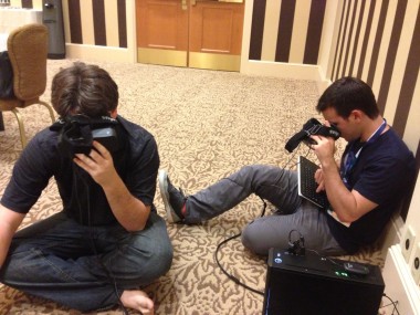 Oculus VR co-founders Palmer Luckey, left, and Nate Mitchell, right, calibrate Oculus Rifts before a demo at PAX.
